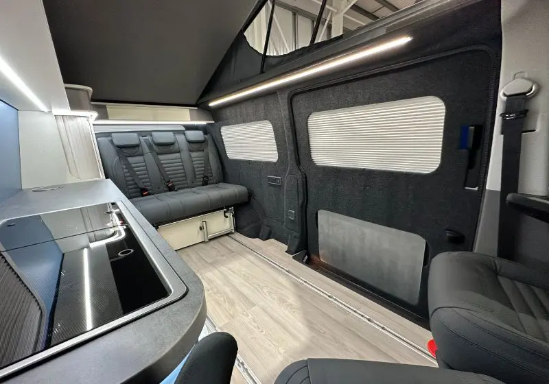 VW Transporter T6 Camper  loxley interior view in light blue with elevated roof 