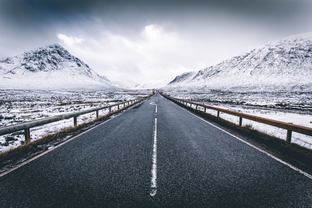 driving down a road in winter